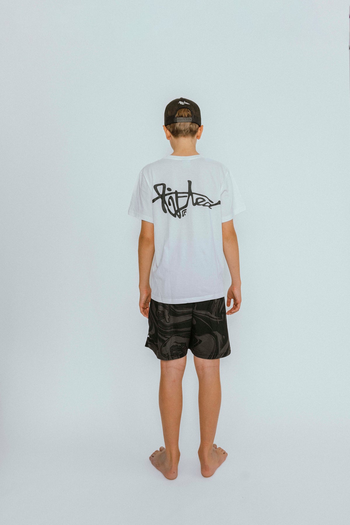 Lifted "Onyx" Shorts back view, black swim shorts