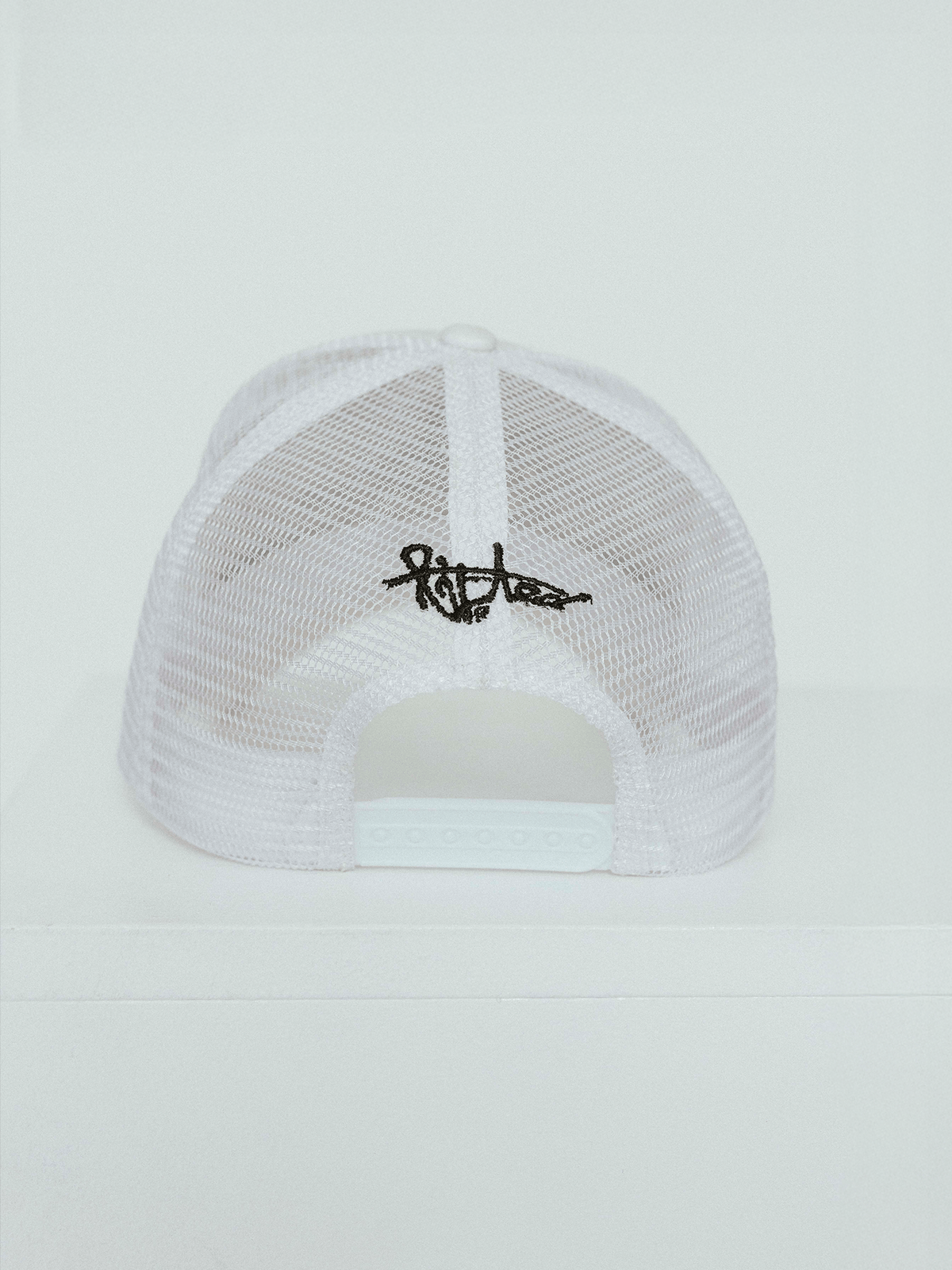 Lifted White Cap detail shot, cotton cap with 3D embroidered logo