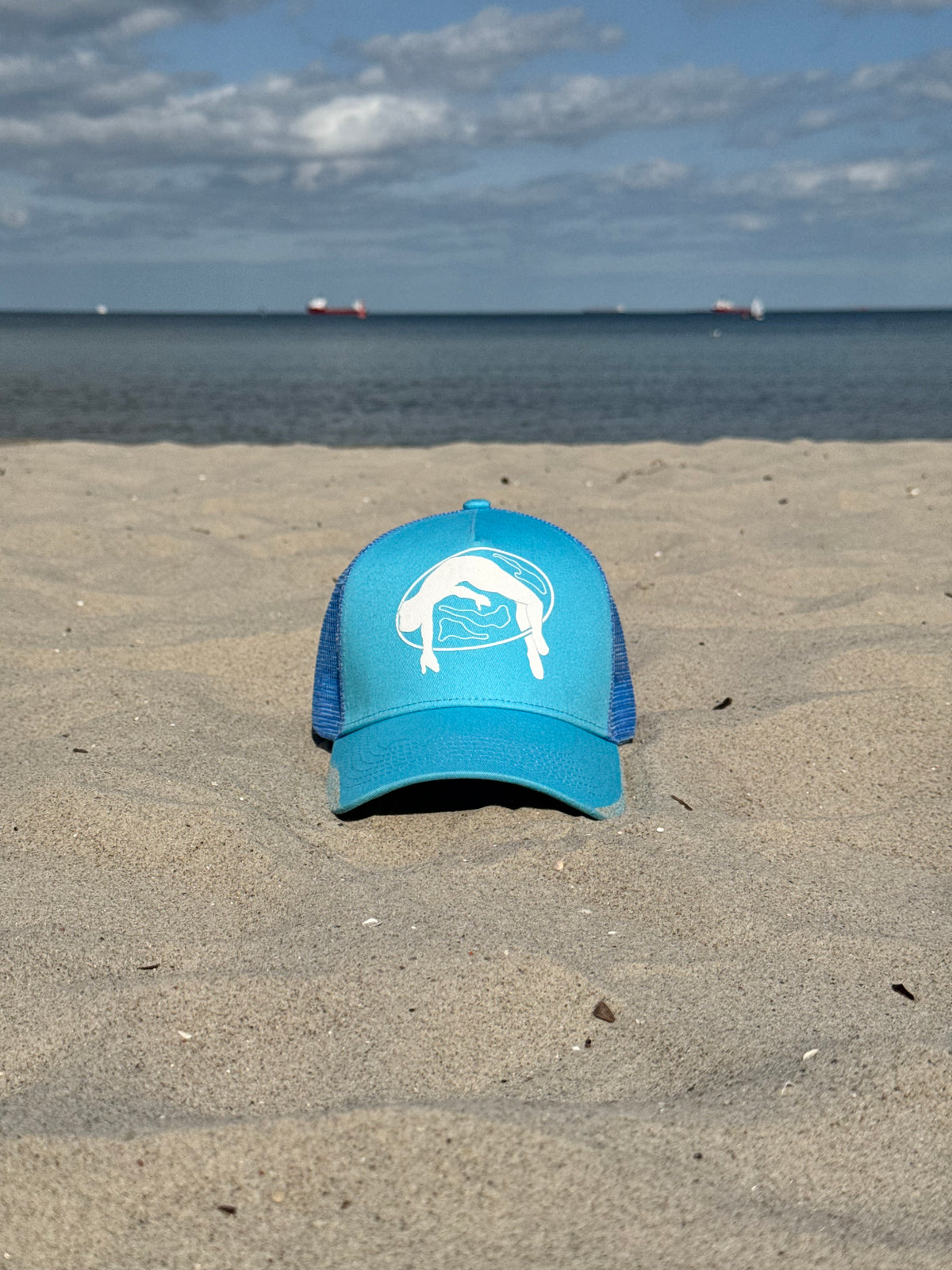 Lifted Sky Cap lifestyle shot, cotton cap with puff-printed logo