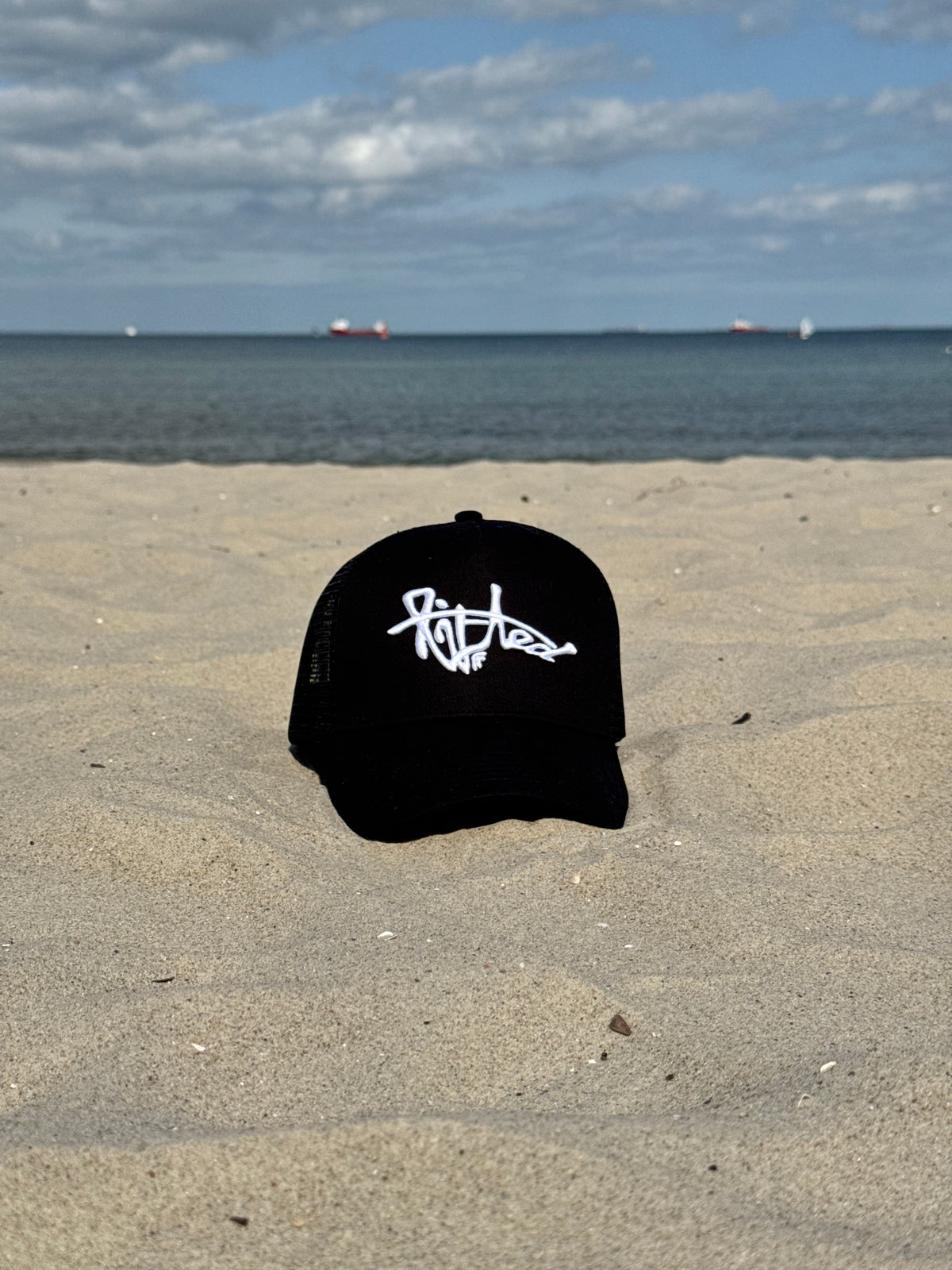 Lifted Black Cap lifestyle shot, cotton cap with 3D embroidered logo