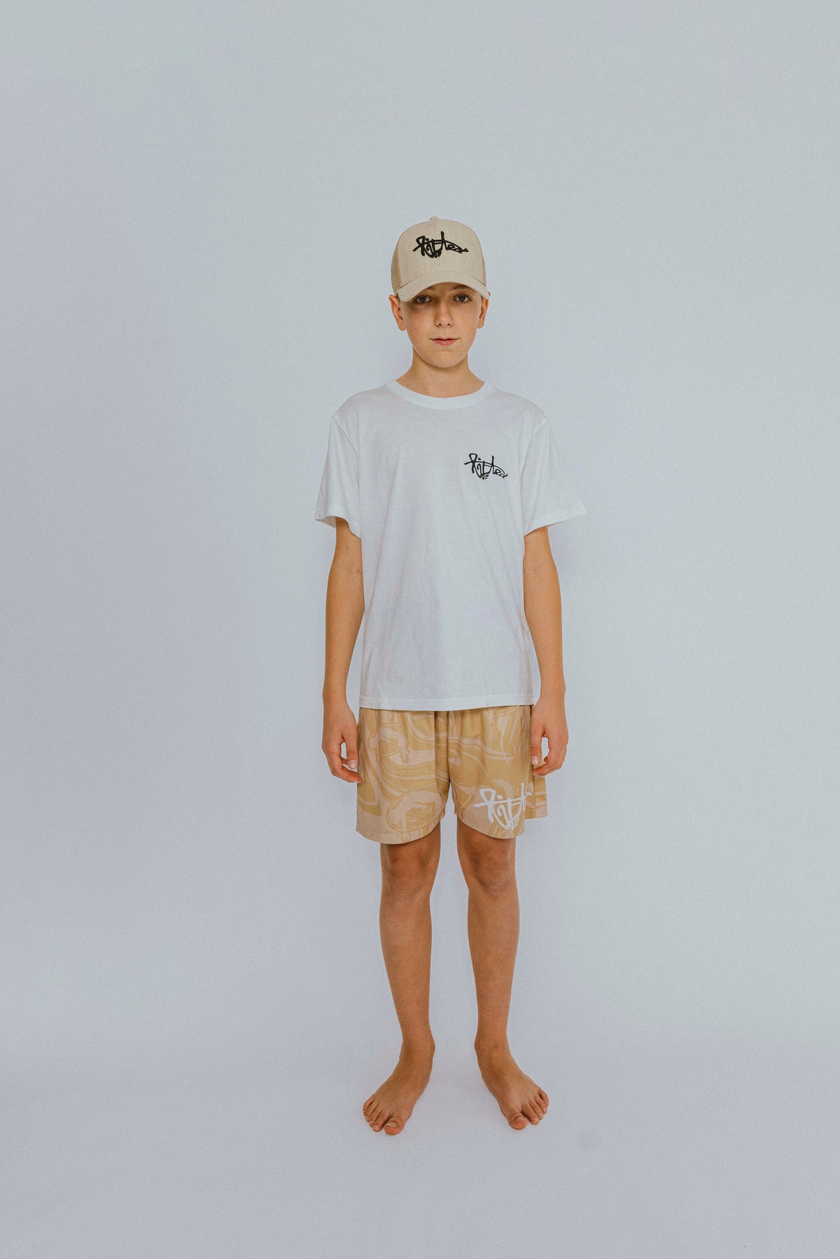 Lifted "Cream" Shorts side view, warm cream swim shorts