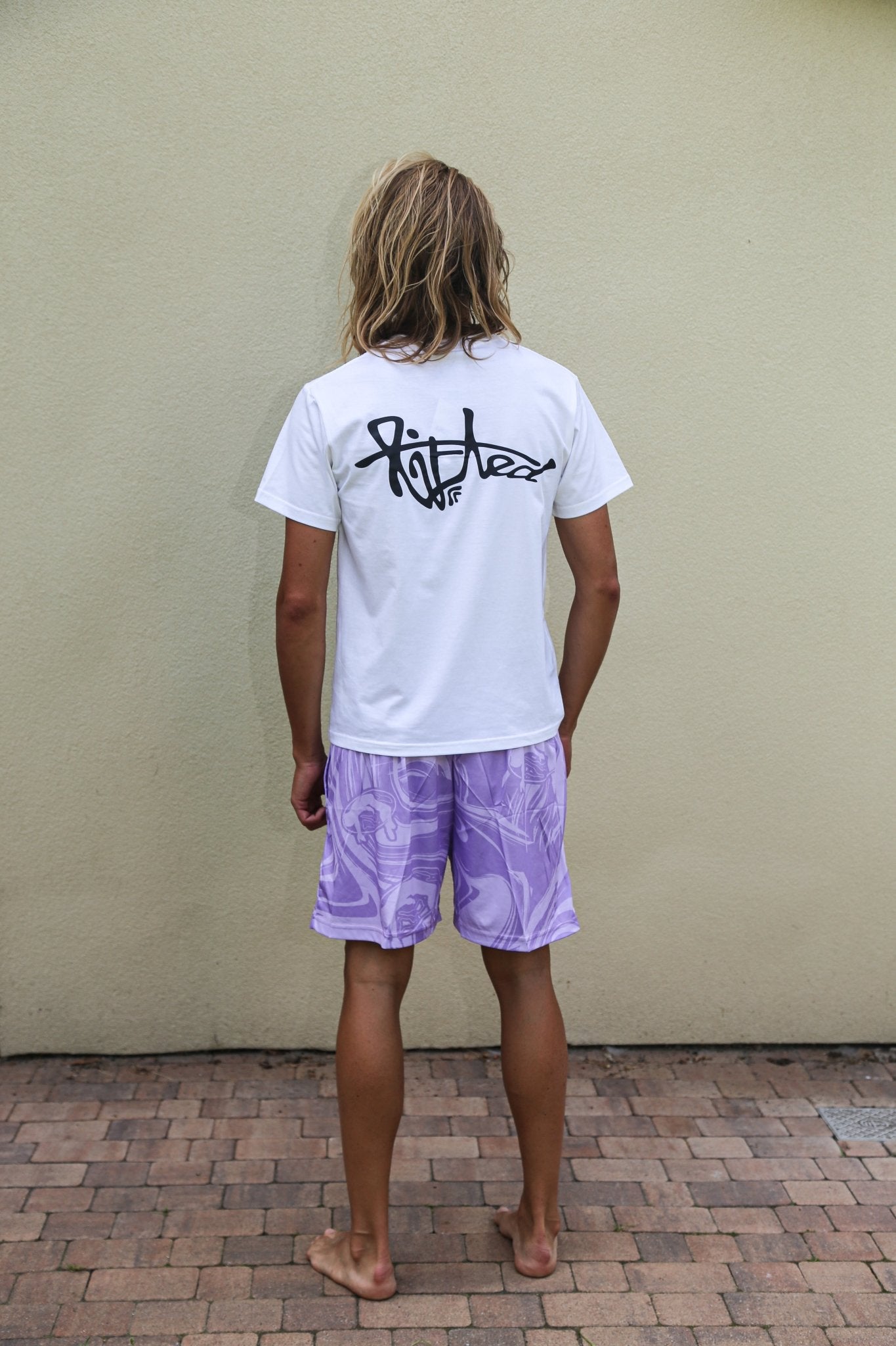 Lifted "Amethyst" Shorts worn lifestyle shot, amethyst purple swim shorts