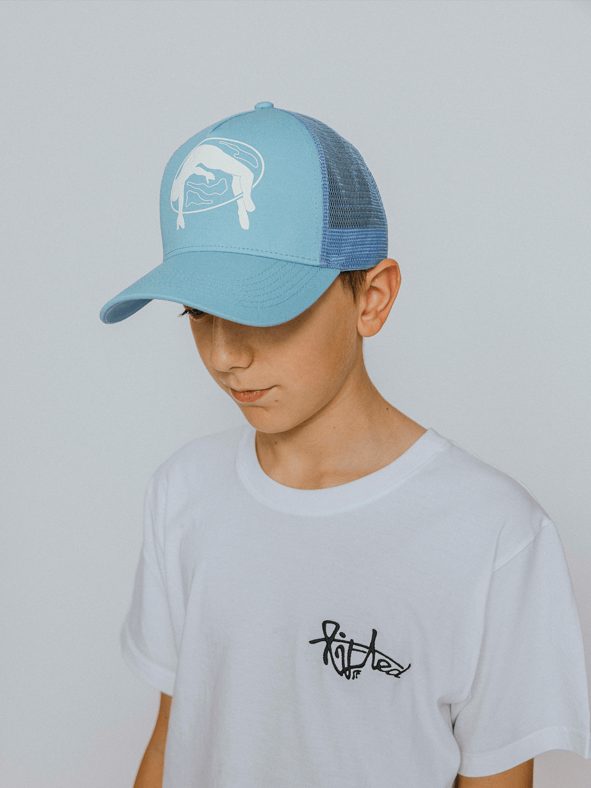 Lifted Sky Cap side view, cotton cap with puff-printed logo