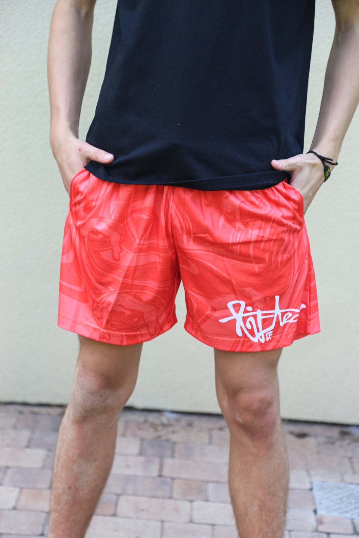 Lifted "Strawberry" Shorts lifestyle shot on model, strawberry red swim shorts